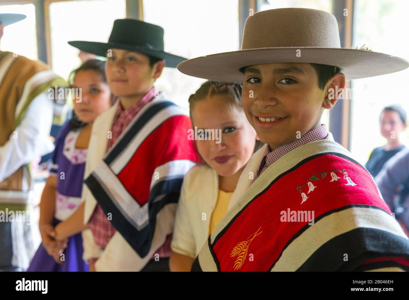 Local children in traditional costumes in Puerto Chacabuco in the Chilean  Fjords in southern Chile Stock Photo - Alamy