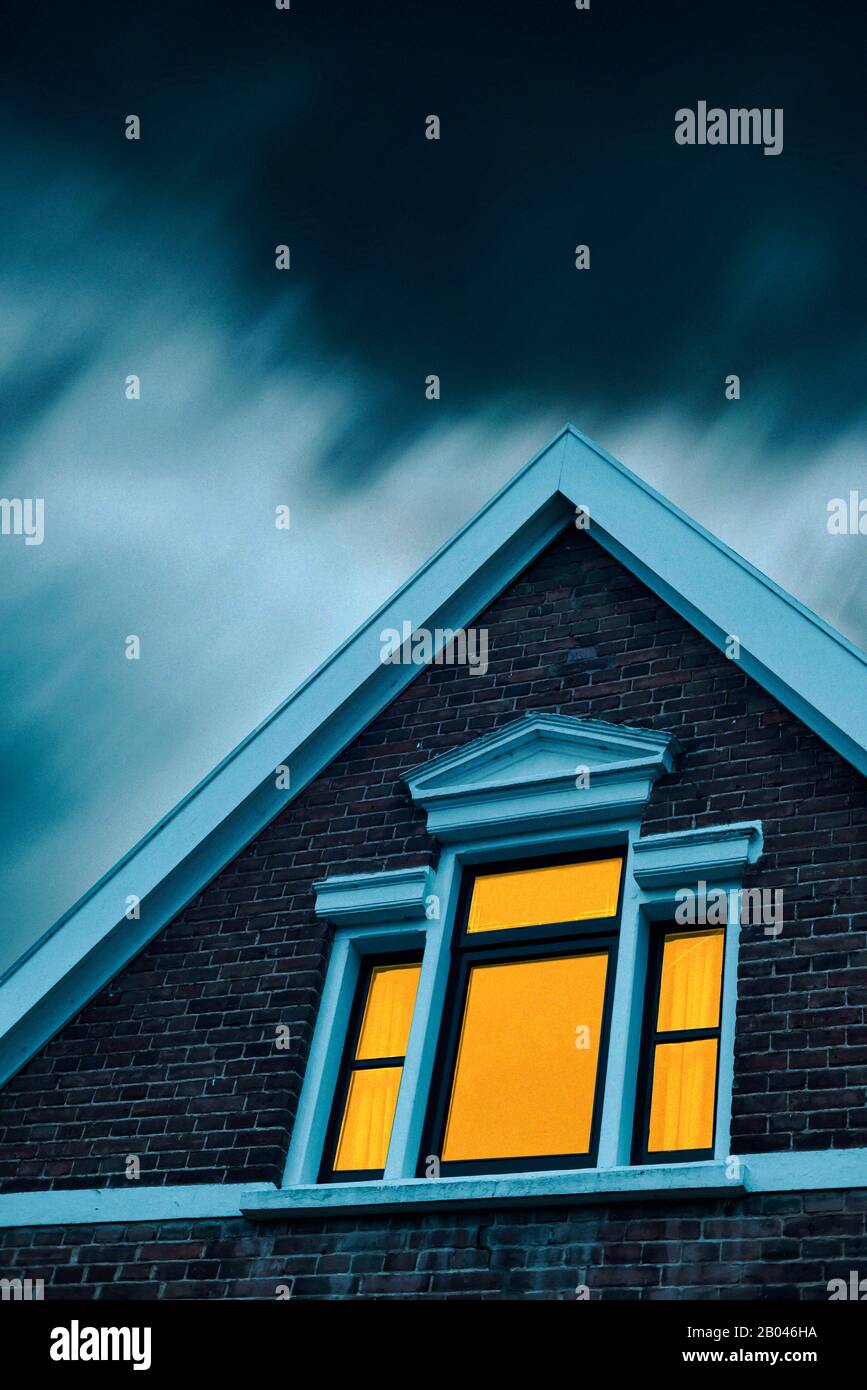 Eerie house illuminated window hi-res stock photography and images - Alamy