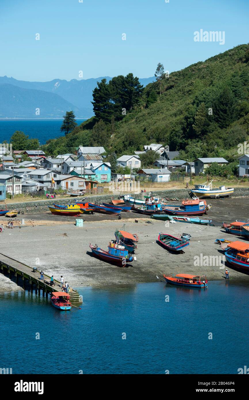 View of colorful fishing boats in Puerto Montt in southern Chile. Stock Photo