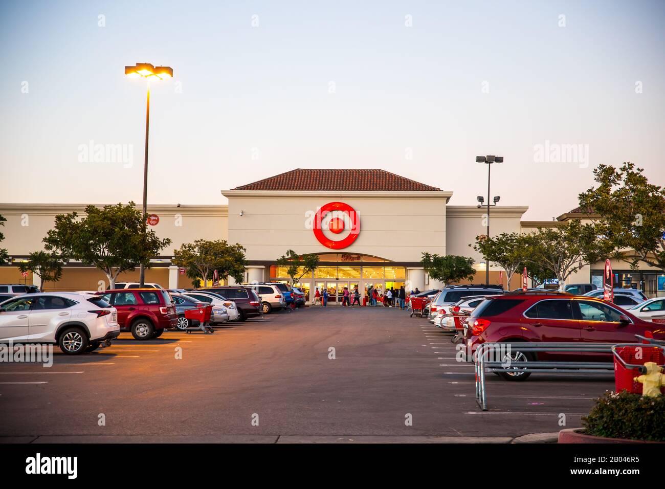 Target grocery shopping parking lot with car at sunset Stock Photo Alamy