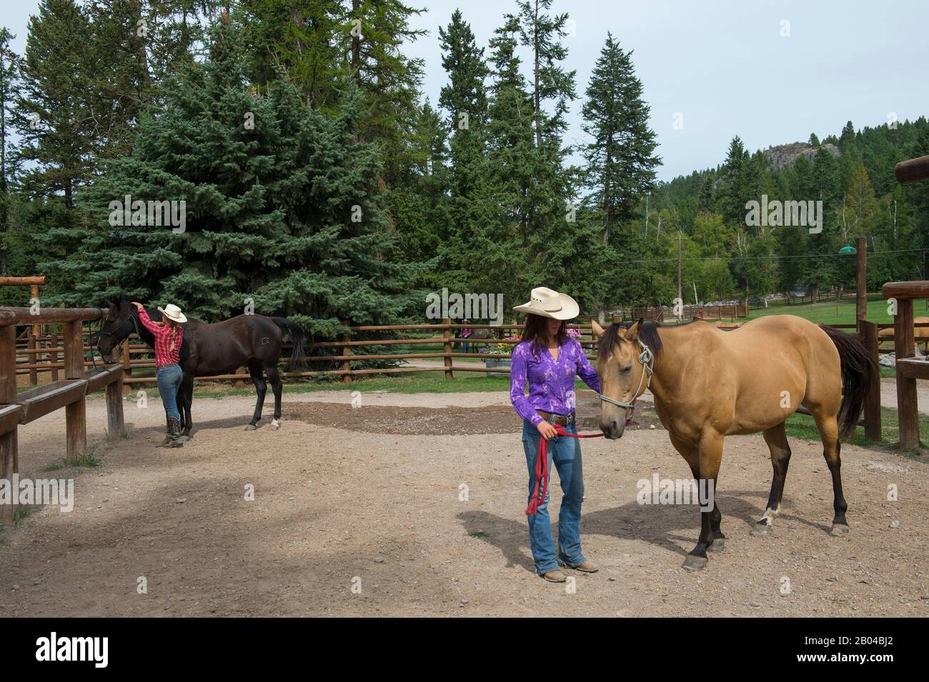 Cowgirls (Wranglers) with their horses at Averill's Flathead Lake Lodge