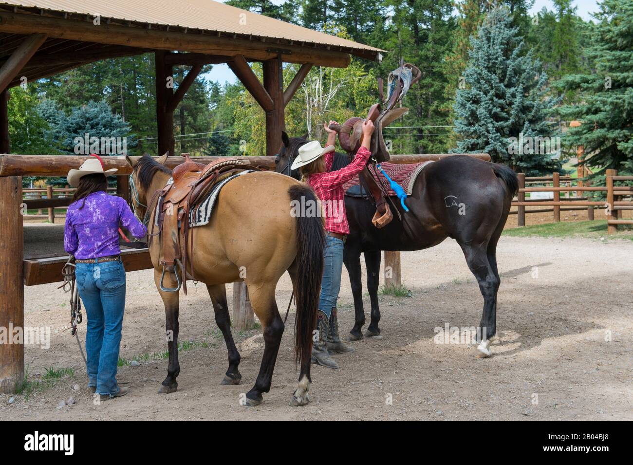 Cowgirls (Wranglers) with their horses at Averill's Flathead Lake Lodge