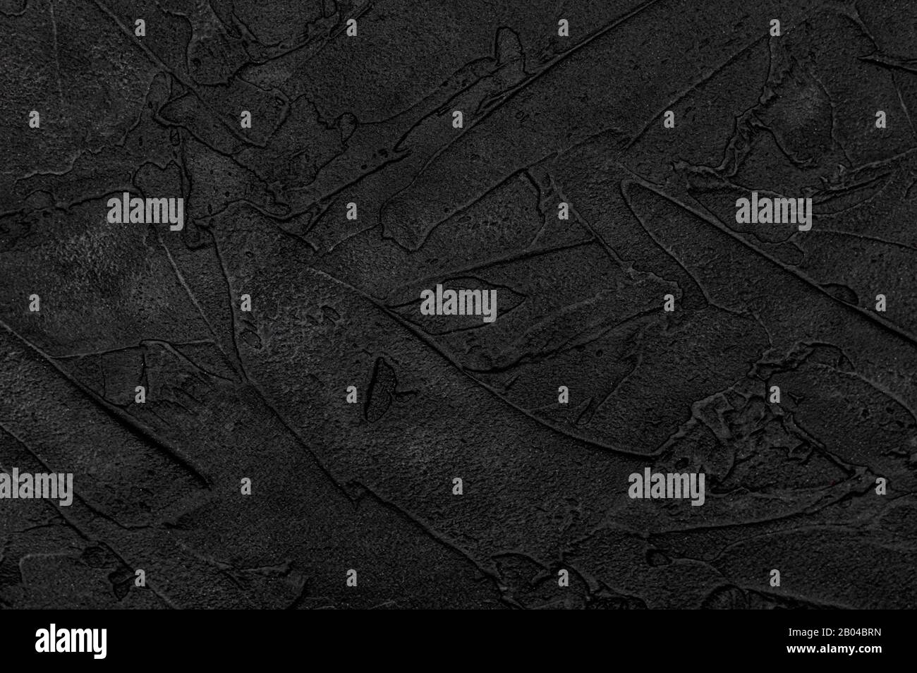 Black concrete wall textured for background. Copy space. Close up. Stock Photo