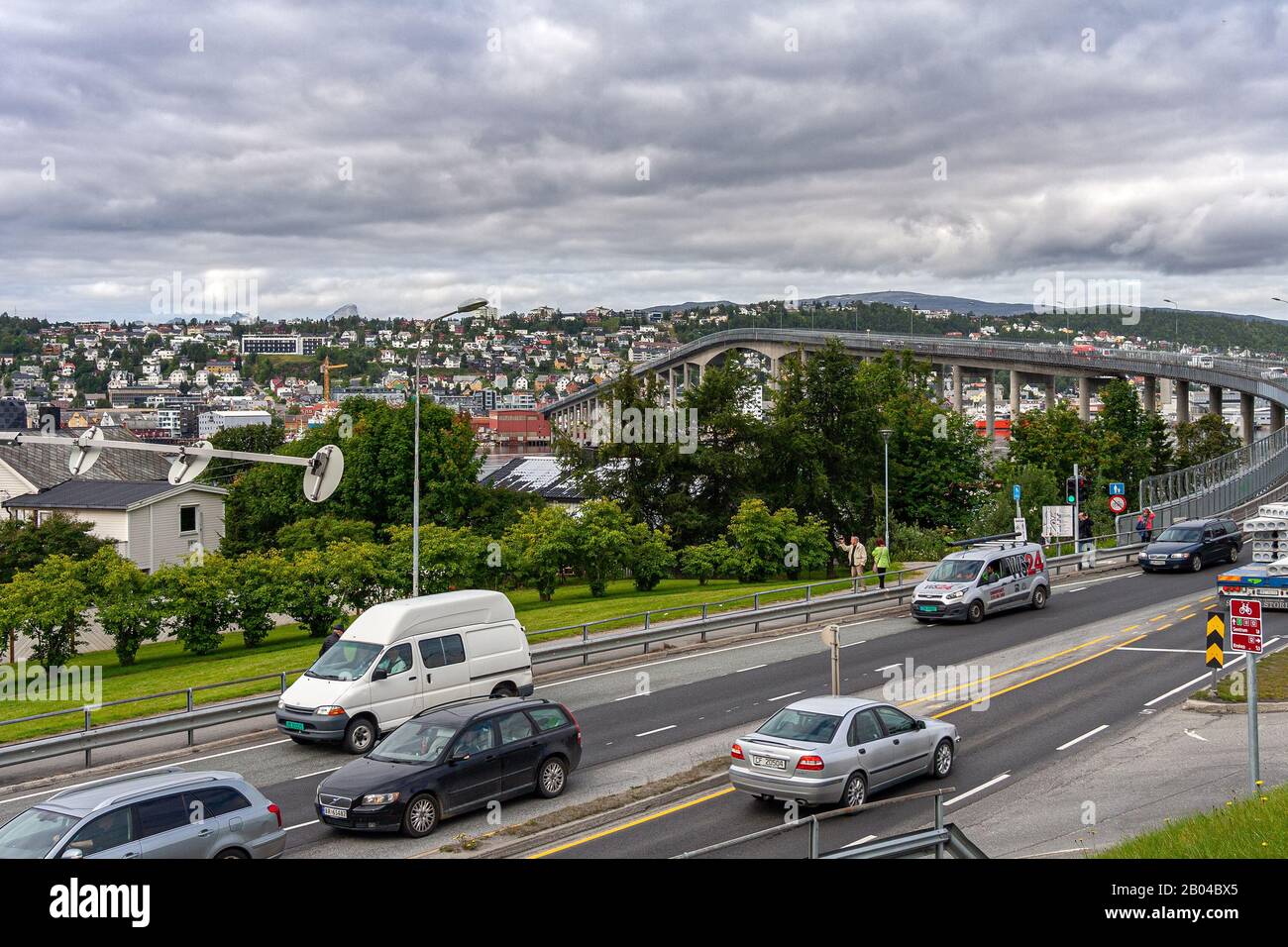 urban landscape of the city of Tromso in Norway. Busy street with bridge leading to the city center. Tromsø, County of Troms og Finnmark, Norway Stock Photo