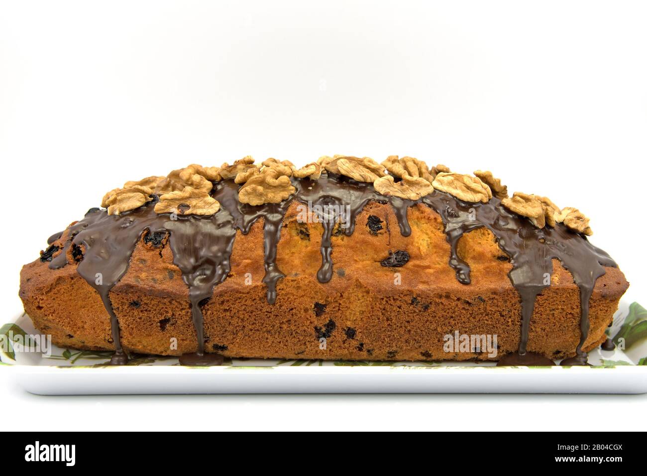 Sponge cake with walnuts against a white background Stock Photo