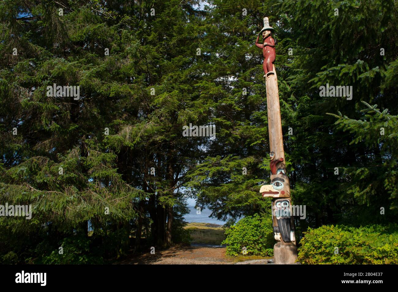 Tlingit totem pole (#10 Raven at the Head of Nass) at the Totem Bight State Historical Park in Ketchikan, Southeast Alaska, USA. Stock Photo