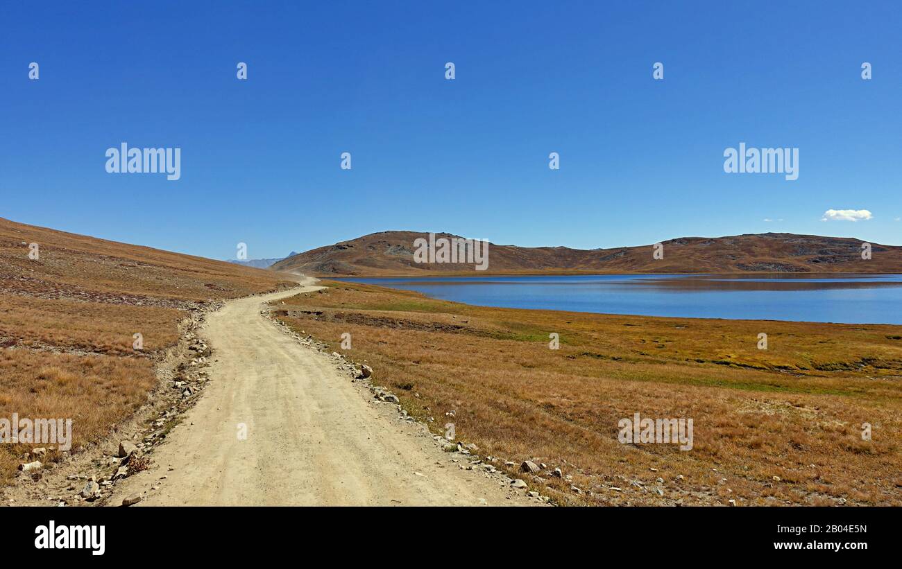 Road  in the Deosai National Park a high-altitude alpine plain and national park in the Northern Gilgit-Baltistan region of Pakistan Kashmir. 2019 Stock Photo