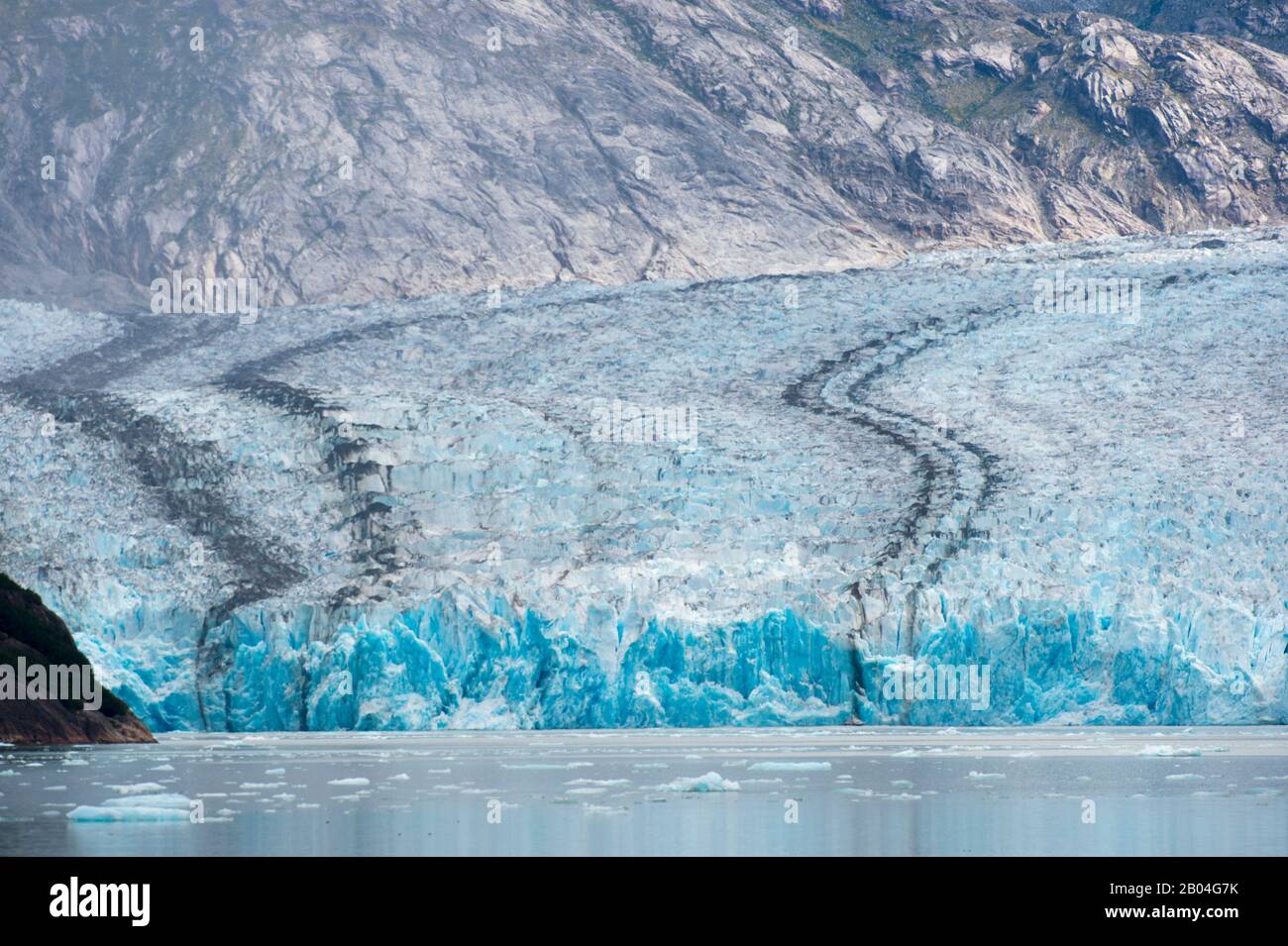 View of the medial moraines of the Dawes Glacier, a tidal glacier in Endicott Arm, Tongass National Forest, Southeast Alaska, USA. Stock Photo