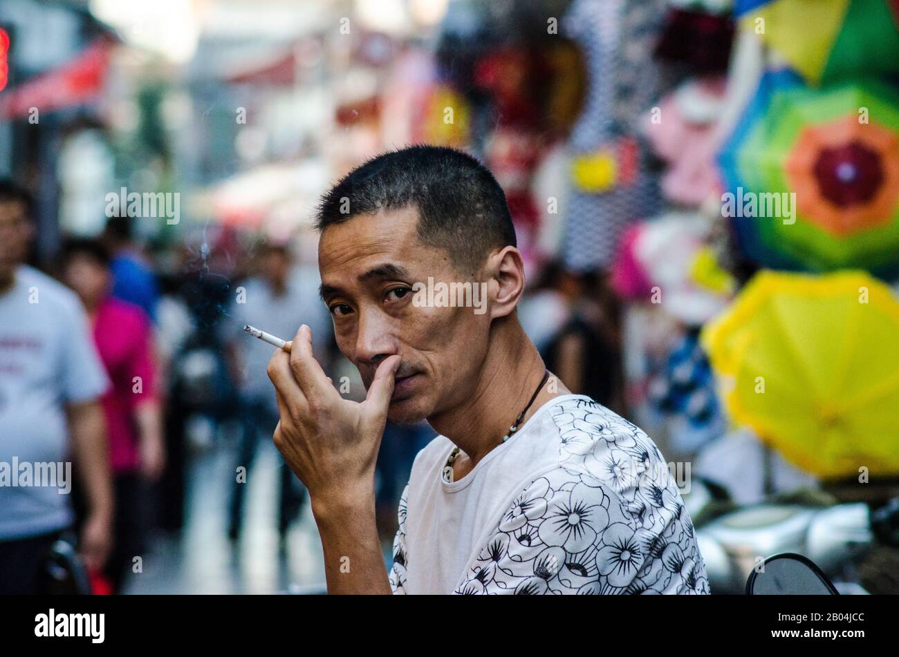 Chinese smoke break Stock Photo