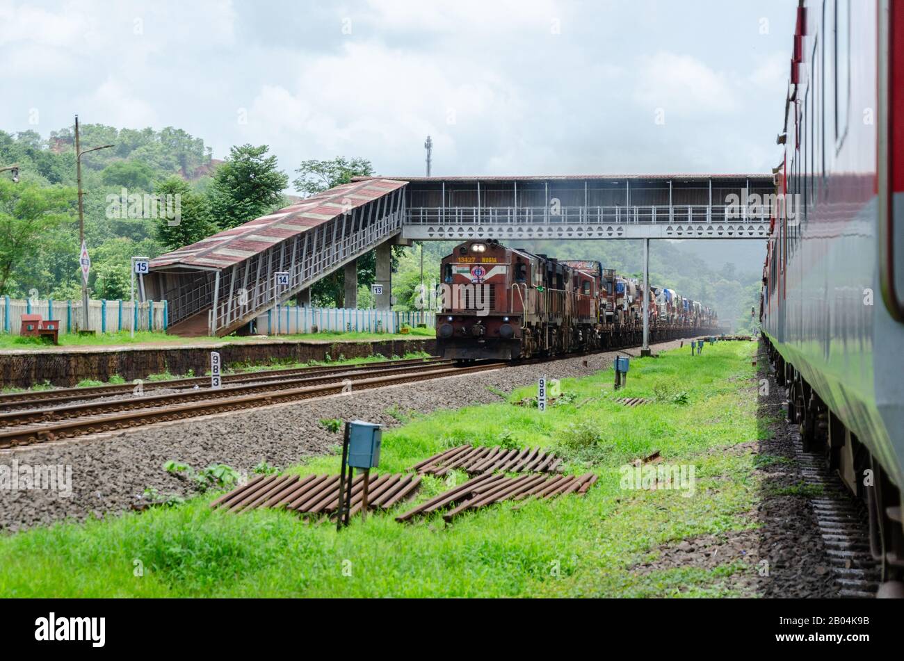 Ro-Ro (Roll On Roll Off) train carrying trucks at Khed Railway Station on Konkan Railway, Maharashtra, India Stock Photo