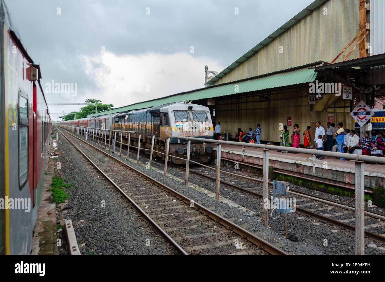 Trivandrum Rajdhani Express arriving at Ratnagiri Railway Station on Konkan Railway, Maharashtra, India Stock Photo