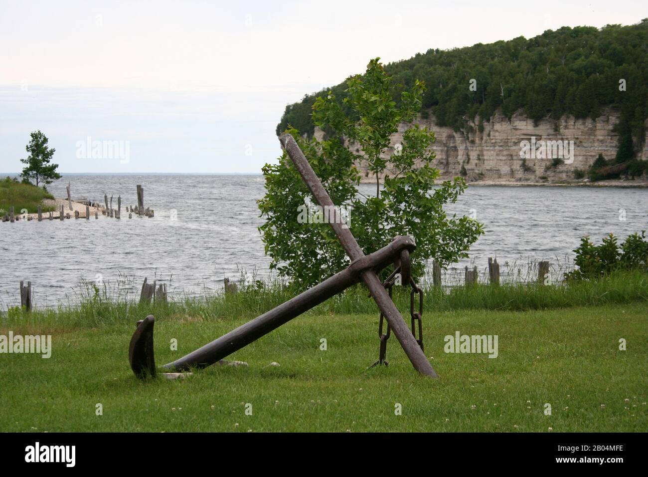 View of Ship Anchor with Snail Shell Harbor and Bluff behind it Stock Photo