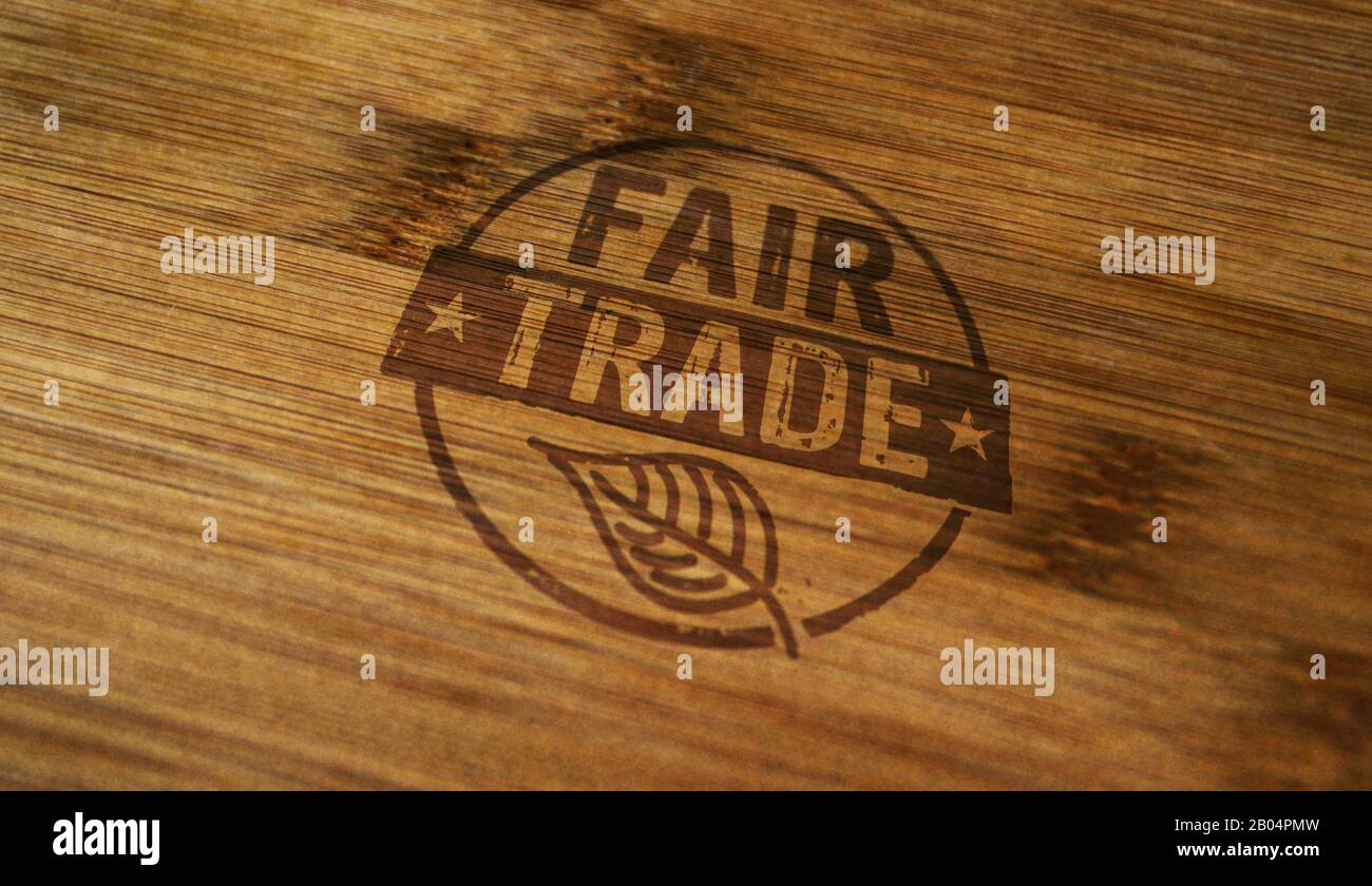 Fair Trade stamp printed on wooden box. Ethical business, green trade, sustainable economy and environmental care concept. Stock Photo