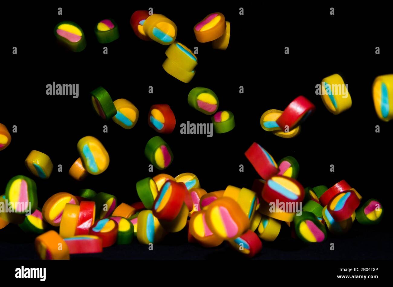 Candies falling down hi-res stock photography and images - Alamy