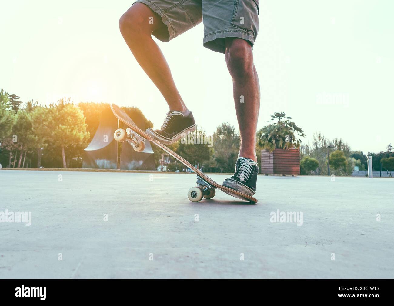 Man legs with skateboard at sunset outdoors - Skater standing on his  longboard - Extreme sport concept - Main focus on right shoe - Vsco filter  Stock Photo - Alamy