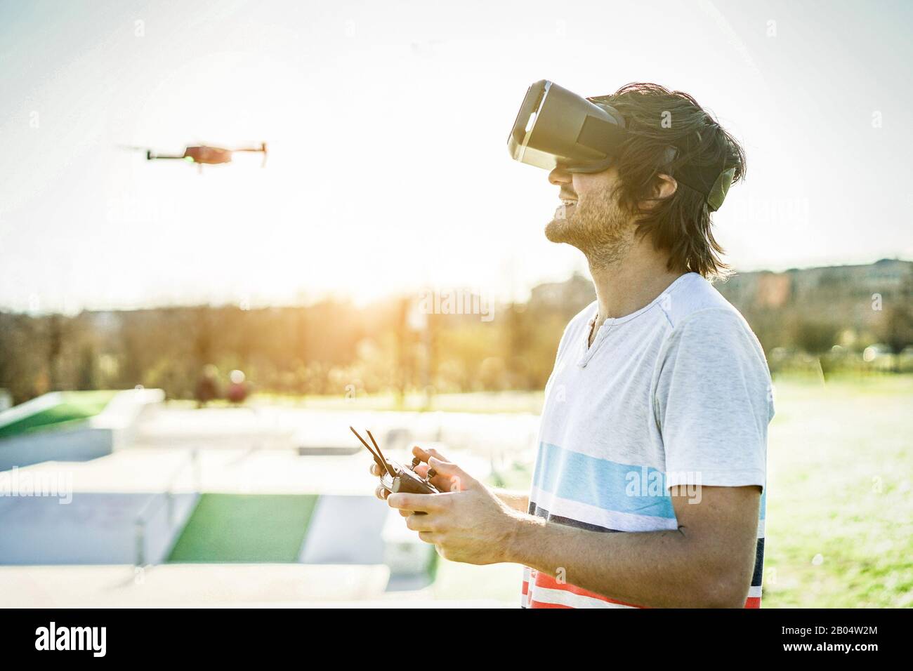 A drone with a pilot and vr headset hires stock photography and images