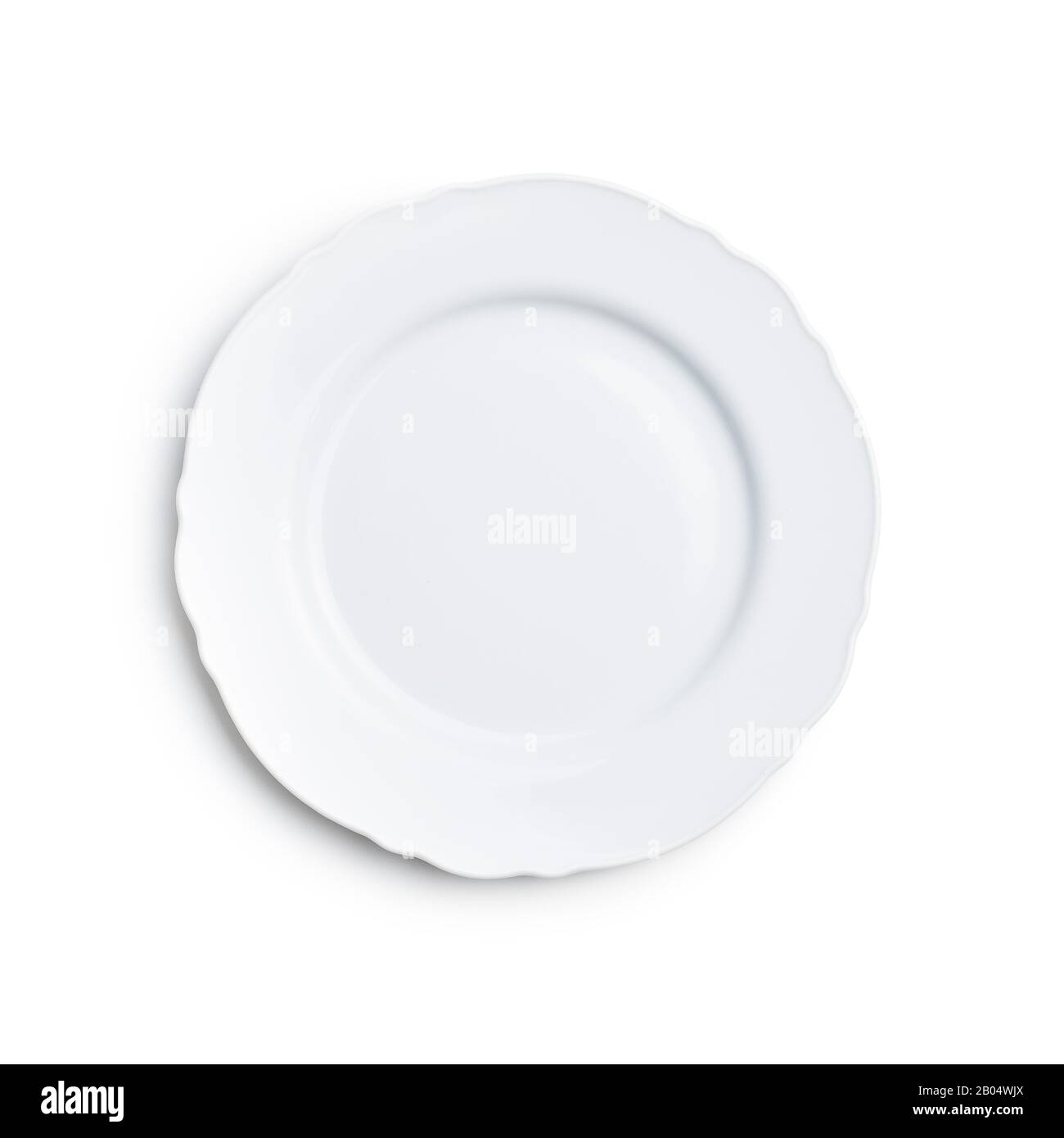 Empty white ceramic plate isolated on white background. Stock Photo