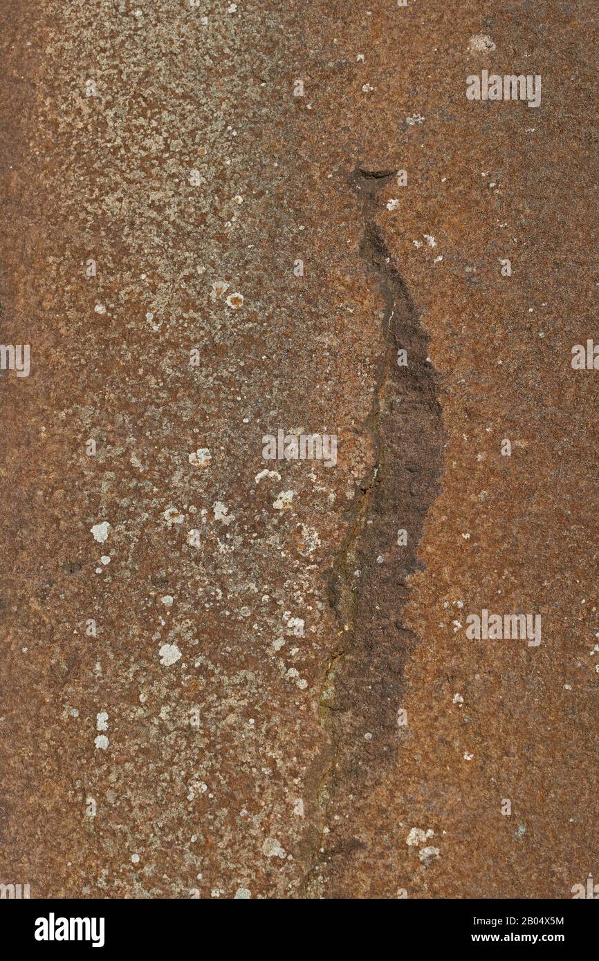 Water stains on sunlit millstone grit rock face Stock Photo Alamy