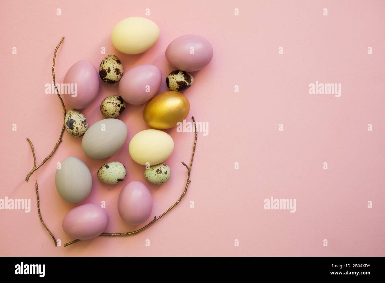 Easter eggs colorful on pink background, flat lay, top view, card for Easter Stock Photo