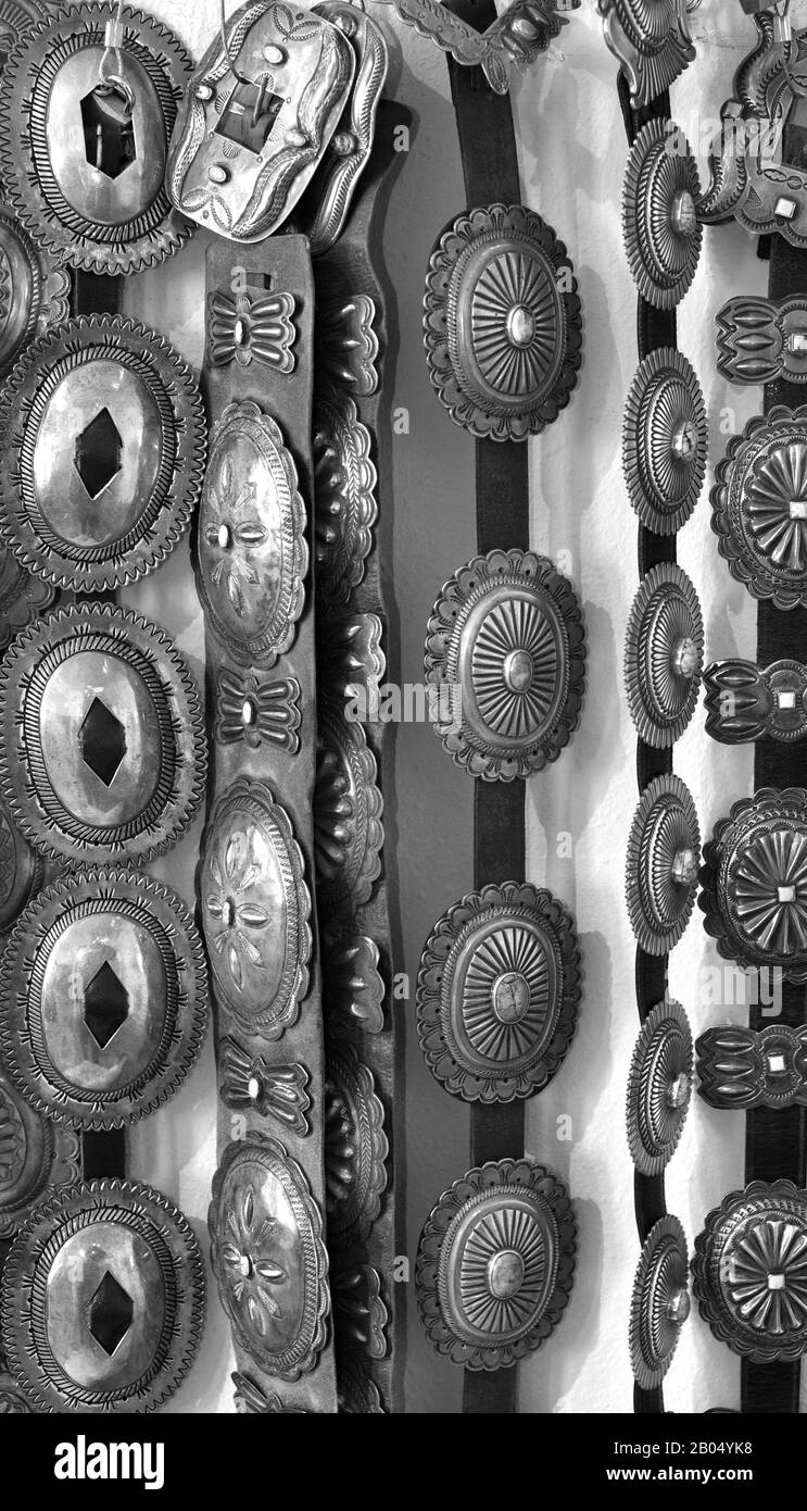 A selection of Native American silver concho belts for sale in a shop in Santa Fe, New Mexico. Stock Photo