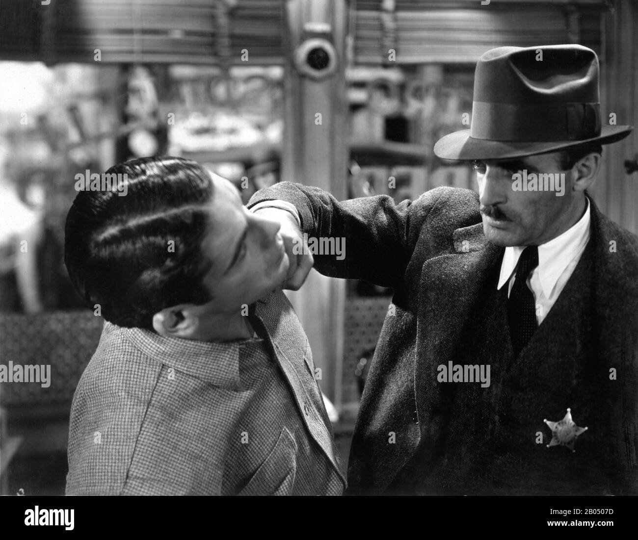 PAUL MUNI as Tony Camonte and C. HENRY GORDON in SCARFACE 1932 ...