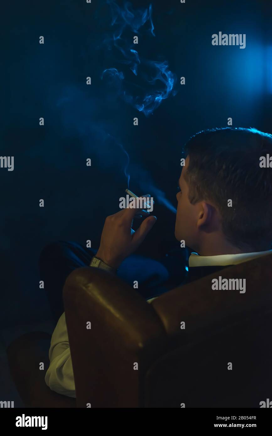 cigarette in dark room A person smoking a a room. Smoke boy the PICRYL 30+ Cigarette Electrical Equipment Dark