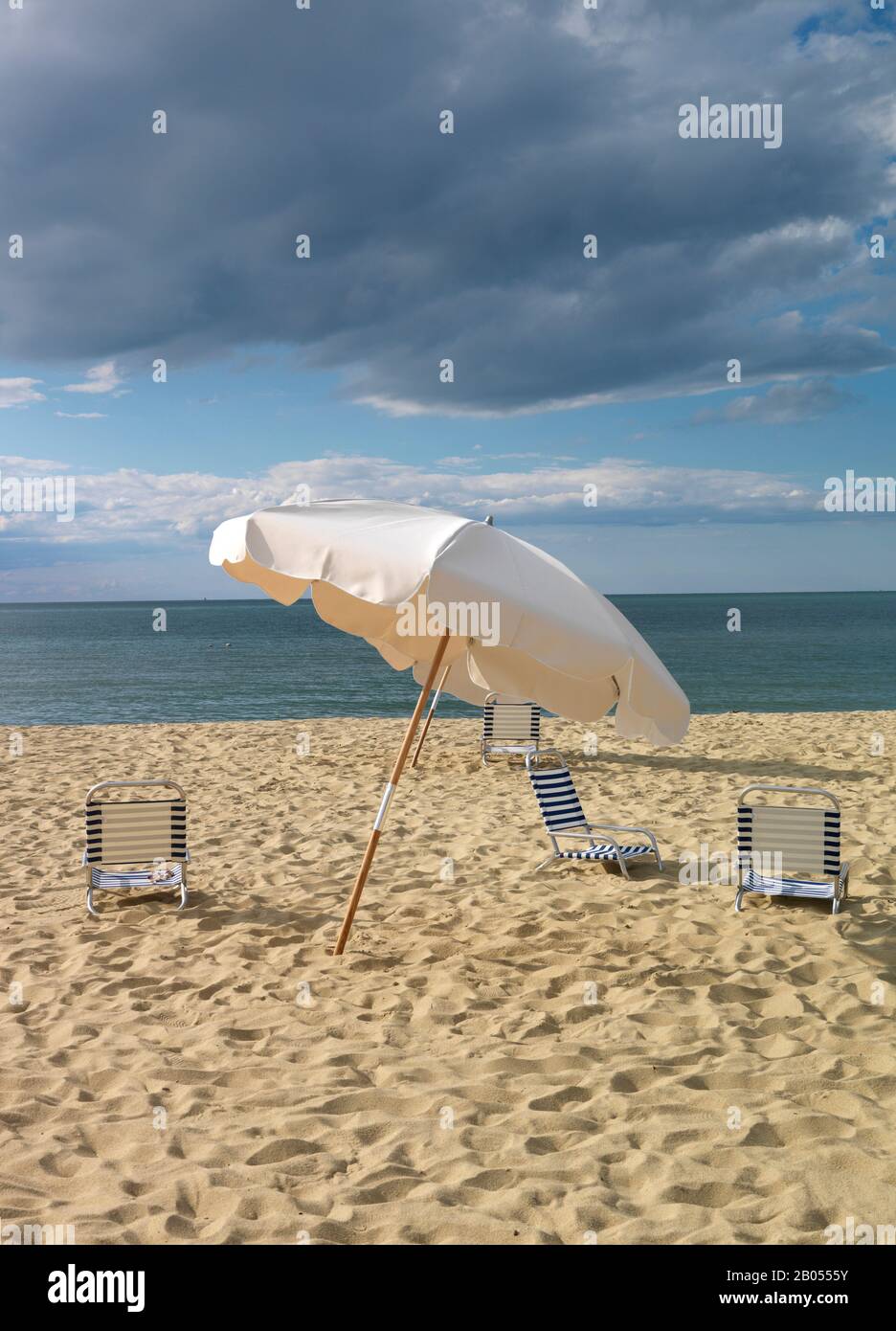 Deck chairs and a beach umbrella on the beach, Jetties Beach, Nantucket