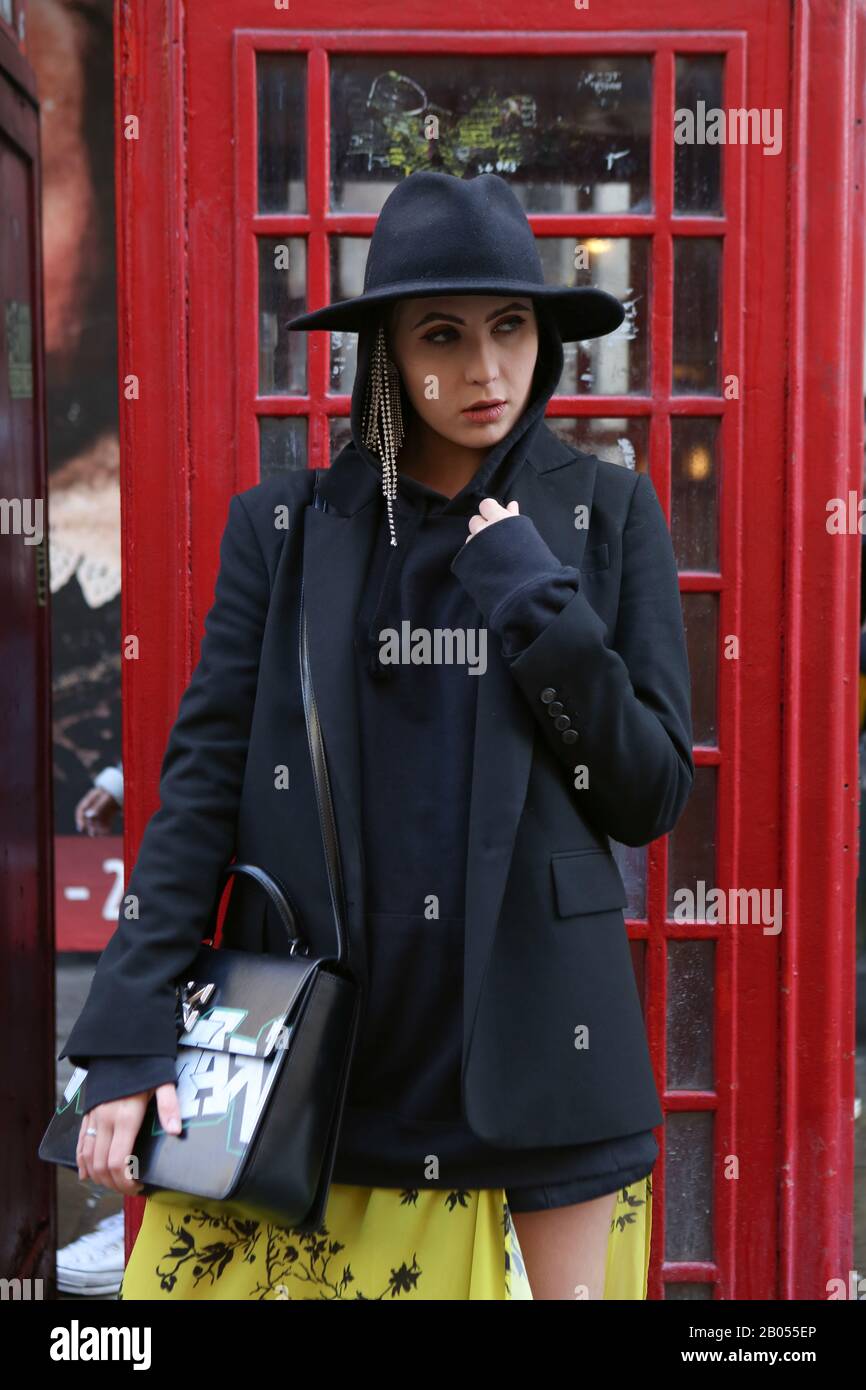 Trendy lady wearing fedora hat phoses 