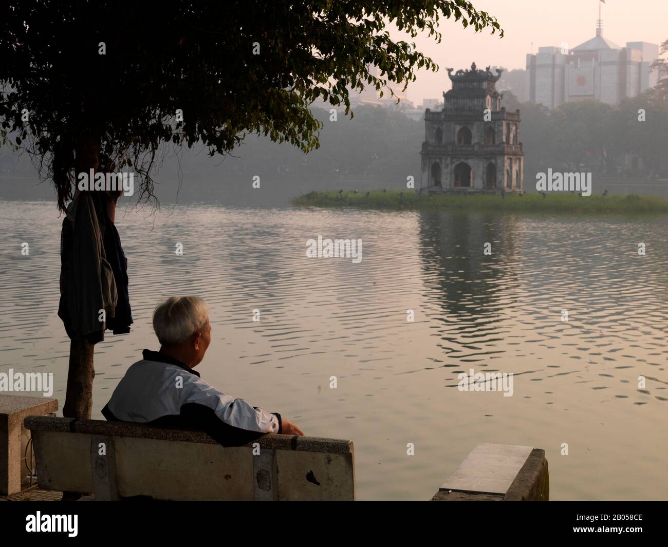 Reflection of a tower in a lake, Tortoise Tower, Hoan Kiem Lake, Hanoi, Vietnam Stock Photo