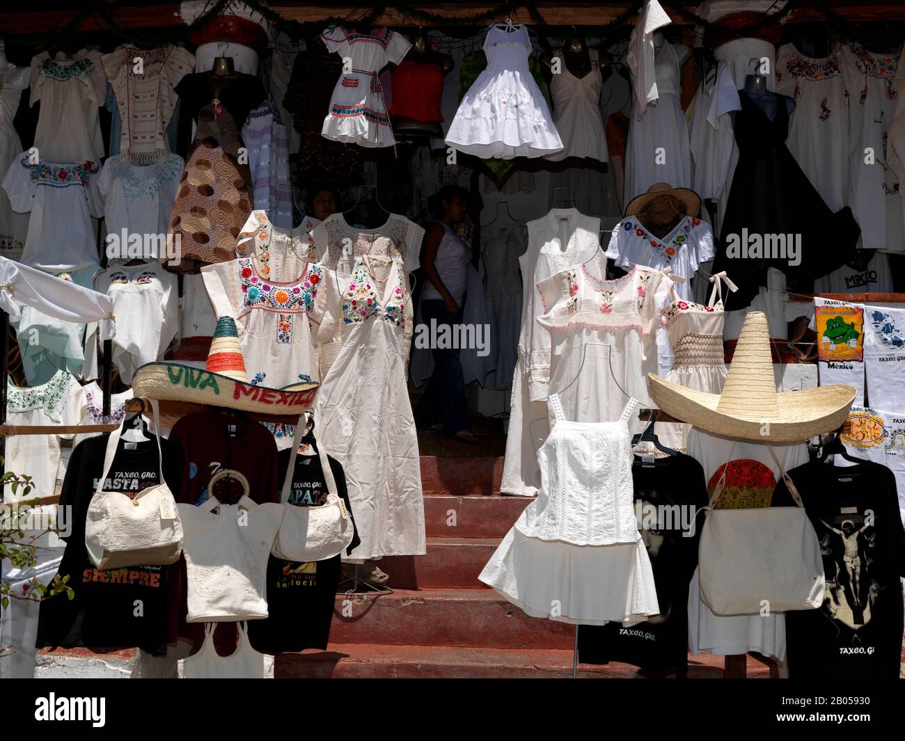 Dresses for sale in a street market, Taxco, Guerrero, Mexico Stock Photo