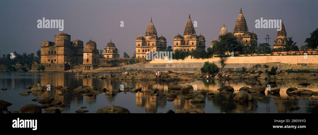 Temples at the waterfront, Betwa River, Orchha, Tikamgarh District, Madhya Pradesh, India Stock Photo