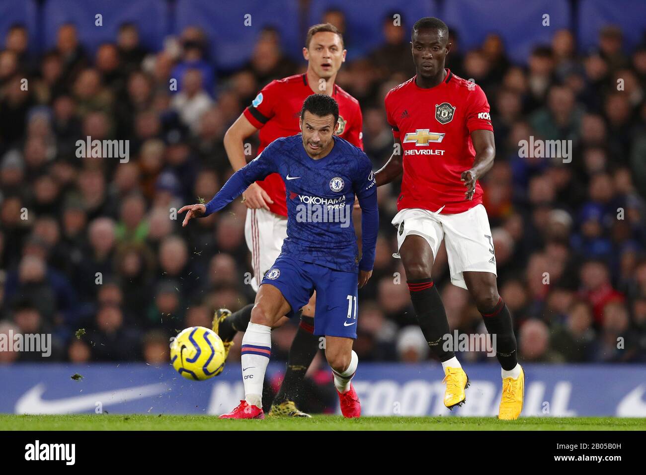 Pedro of Chelsea in action with Nemanja Matic (L) and Eric Bailly (R) of Manchester United - Chelsea v Manchester United, Premier League, Stamford Bridge, London, UK - 17th February 2020  Editorial Use Only - DataCo restrictions apply Stock Photo