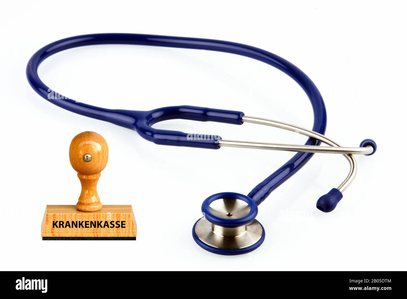 stamp lettering Krankenkasse, medical insurances, stethoscope, Germany Stock Photo