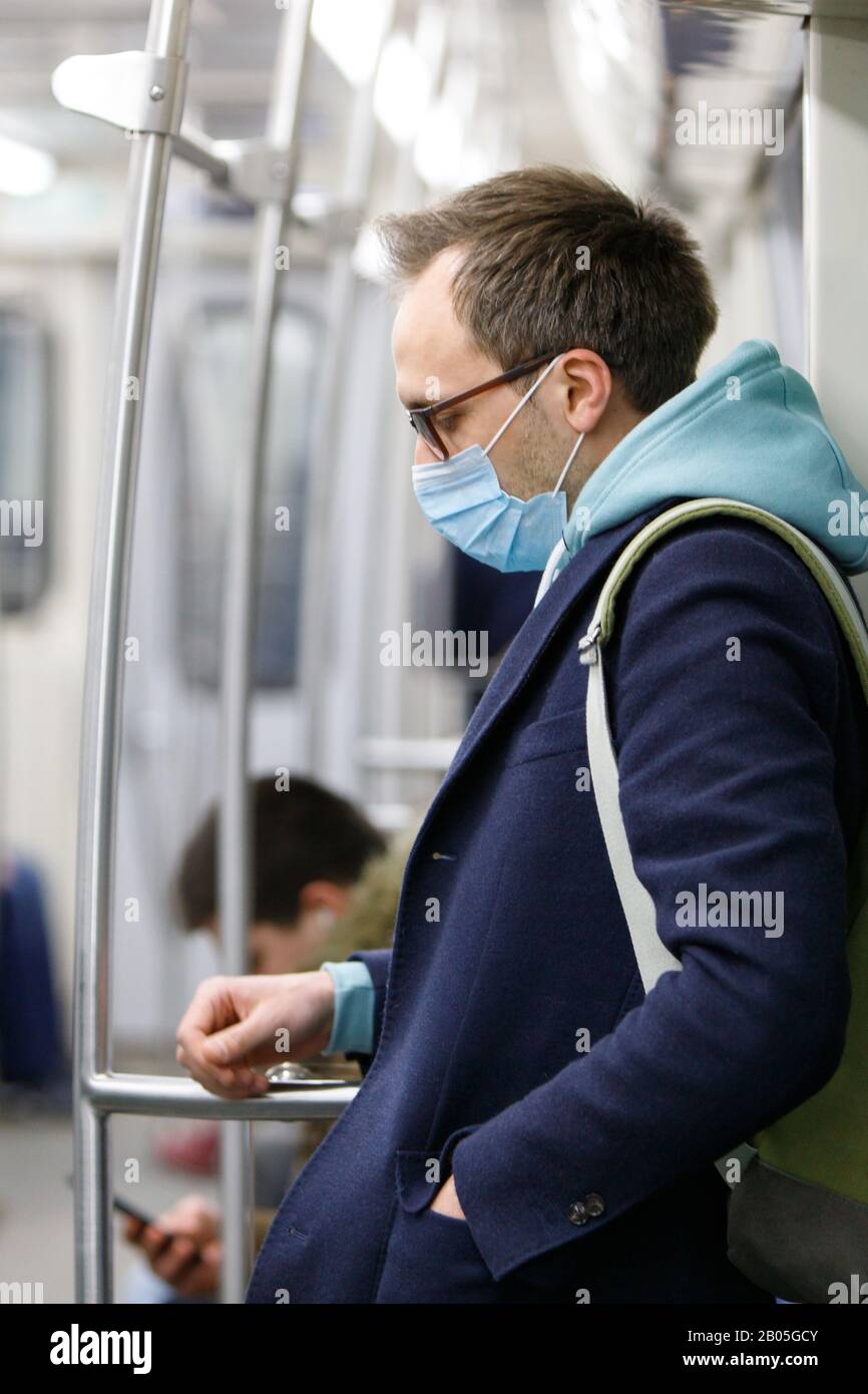 against transmissible infectious diseases and as protection against the flu in public transport. New virus grippe 2019-nCoV, coronavirus from China Stock Photo