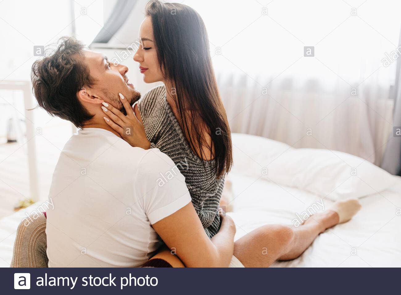 Couple Bed Bedroom Kiss Love Romance Hugging High Resolution Stock Photography And Images Alamy