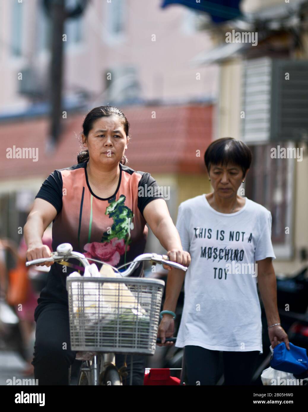 Chinese women riding bicycle hires stock photography and images Alamy