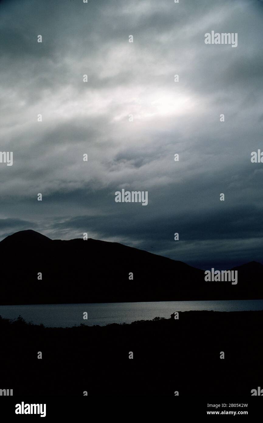 USA, ALASKA, KODIAK ISLAND DARK STRATUS CLOUDS OVER FRAZER LAKE Stock Photo