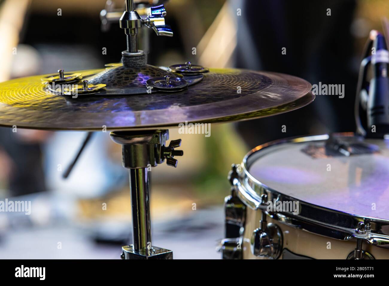A detailed view of a percussion kit showing a hi hat cymbal fixed ...
