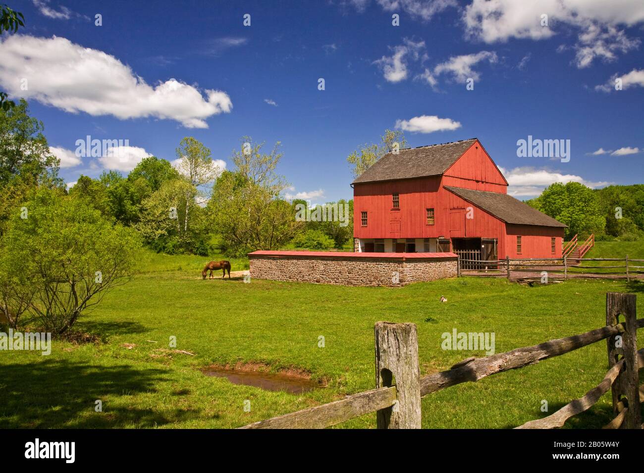 Red barn at Daniel Boone Homestead in Berks Co., Pennsylvania, USA, Pa images pioneer Spring 2008 farming horse Barnyard historical images Stock Photo