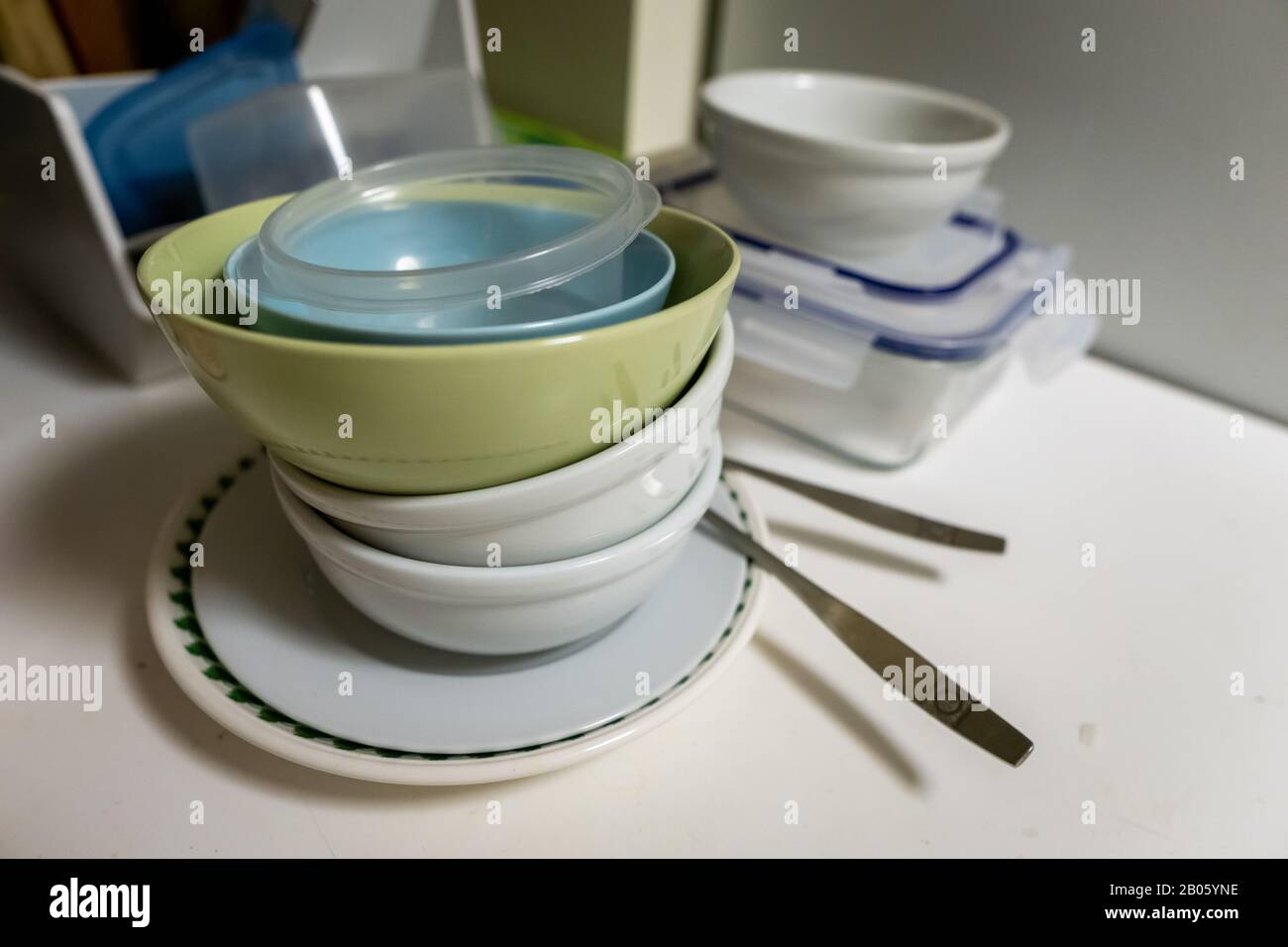 Dishes and bowls in kitchen Stock Photo