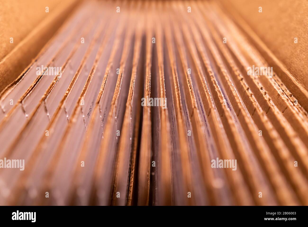 A pack of cardboard boxes under warm light Stock Photo