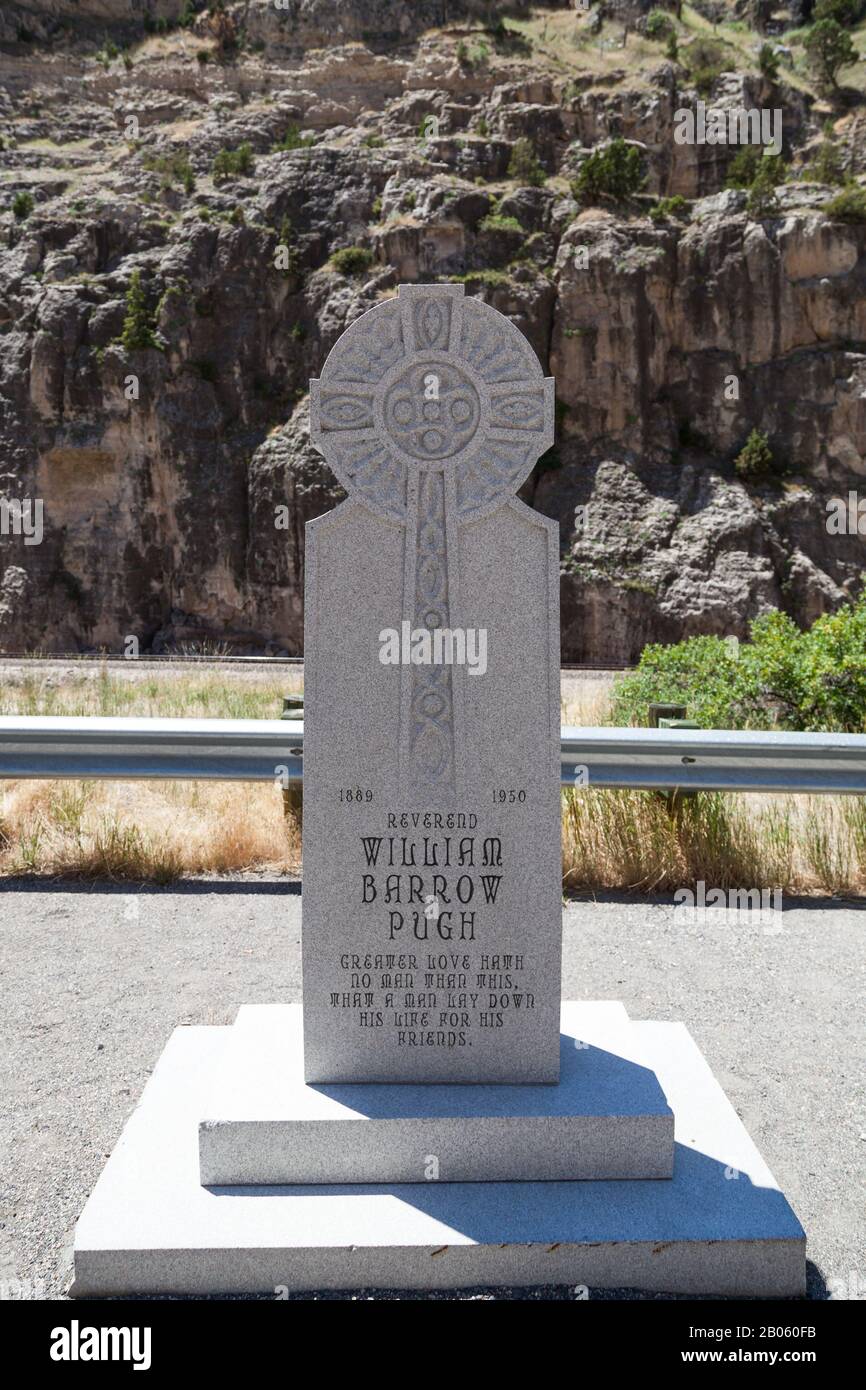 WIND RIVER CANYON, WYOMING - July 6, 2014: A large carved stone marker stands as a memorial for the Reverend William Barrow Pugh in the Wind River Can Stock Photo