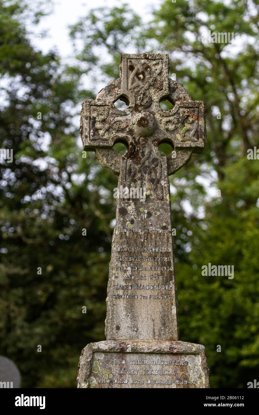 Balquhidder, Scotland  - September 17 2019: Close up fo a Celtic Cross Headstone in the local cemetery, UK September 17, 2019 Stock Photo