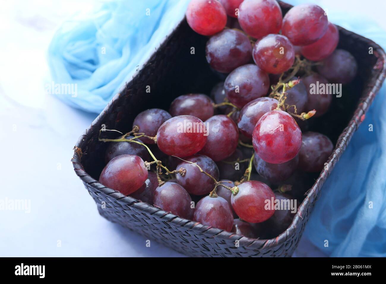 Close up of red grape in a container on table  Stock Photo