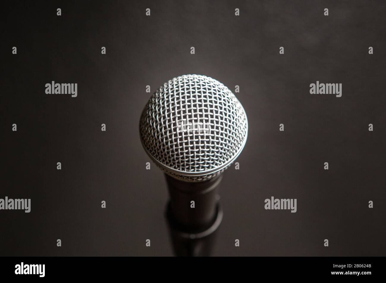 Comedy or Music Show at Night with  Microphone and Blue Lights Nightlife Stock Photo