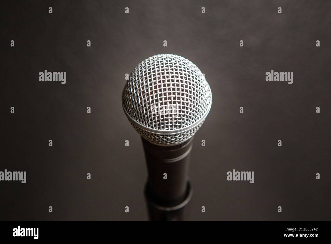 Comedy or Music Show at Night with  Microphone and Blue Lights Nightlife Stock Photo
