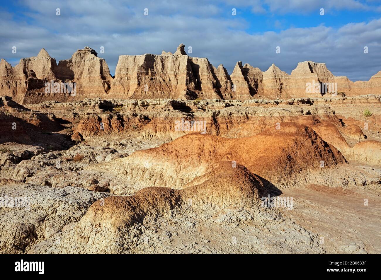 SD00129-00...SOUTH DAKOTA - Colorful layers of sandstone and eroded buttes along the Door Trail in Badlands National Park. Stock Photo