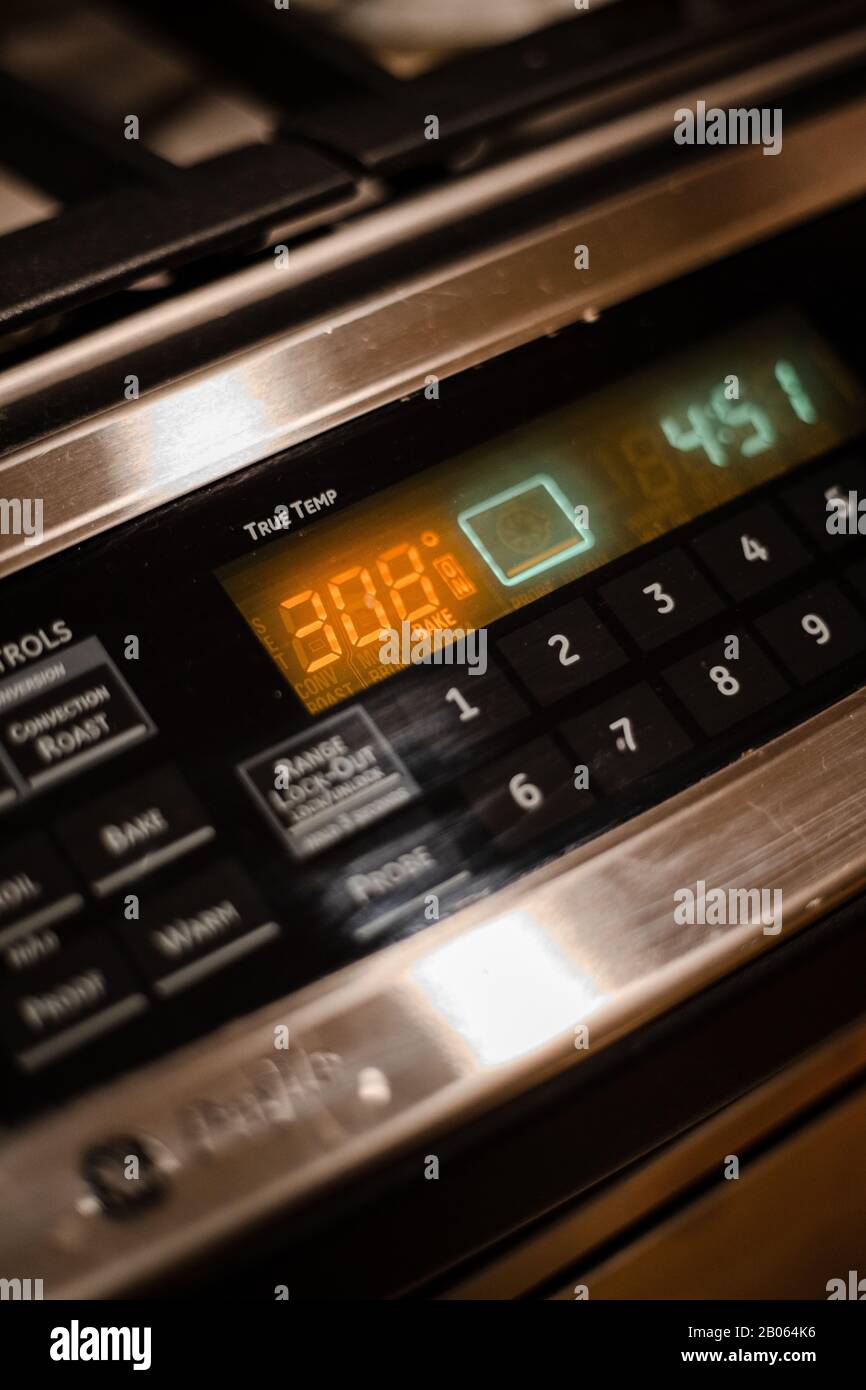 Front control board of a stainless steel oven with the temperature of 308°F bake Stock Photo