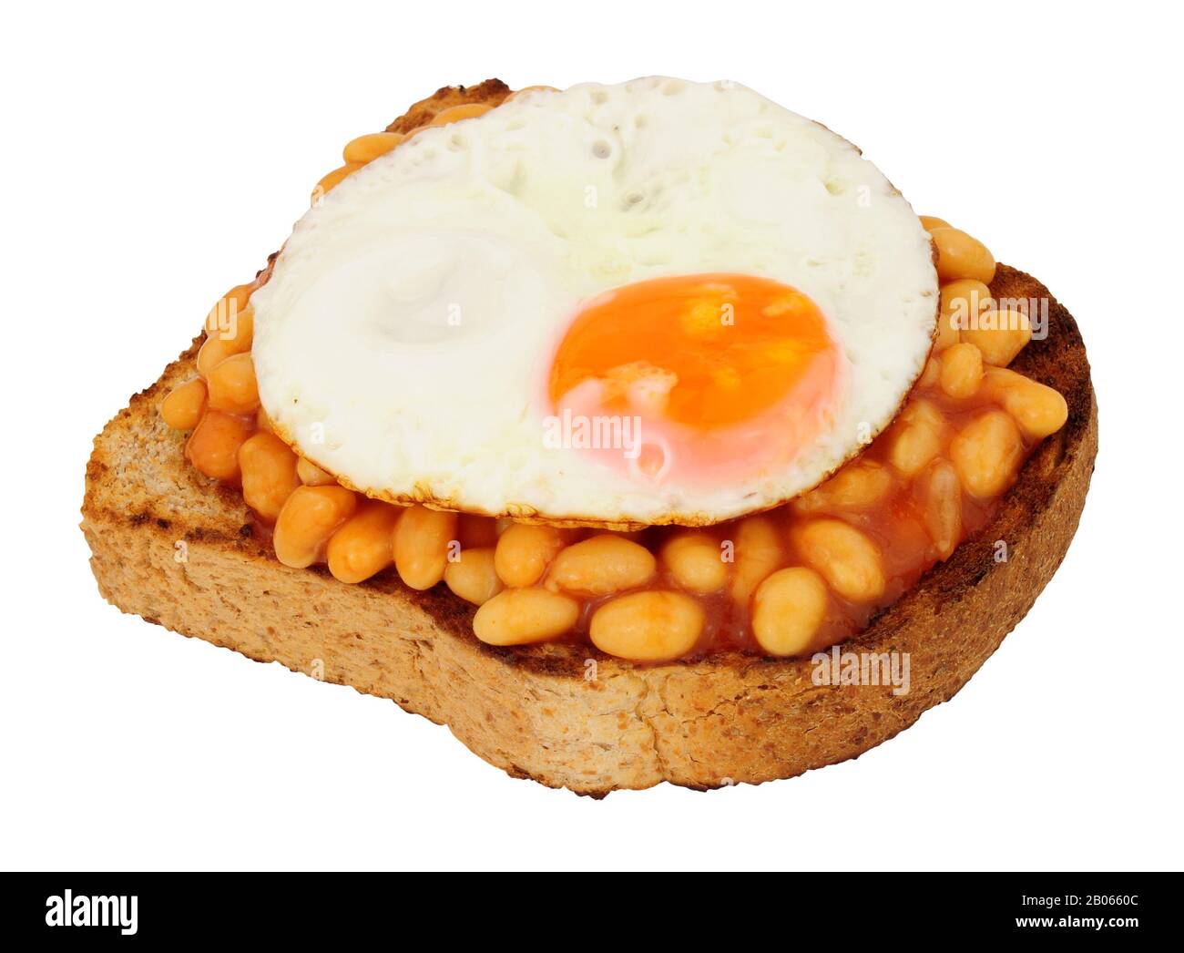 Fried egg and baked beans with tomato sauce on toast isolated on a white background Stock Photo