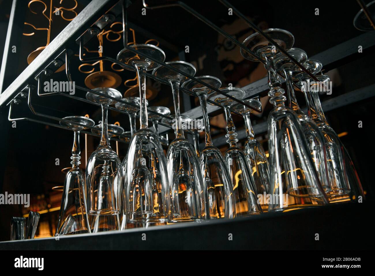 Clean glasses over the bar. Clean glasses for alcoholic beverages hang